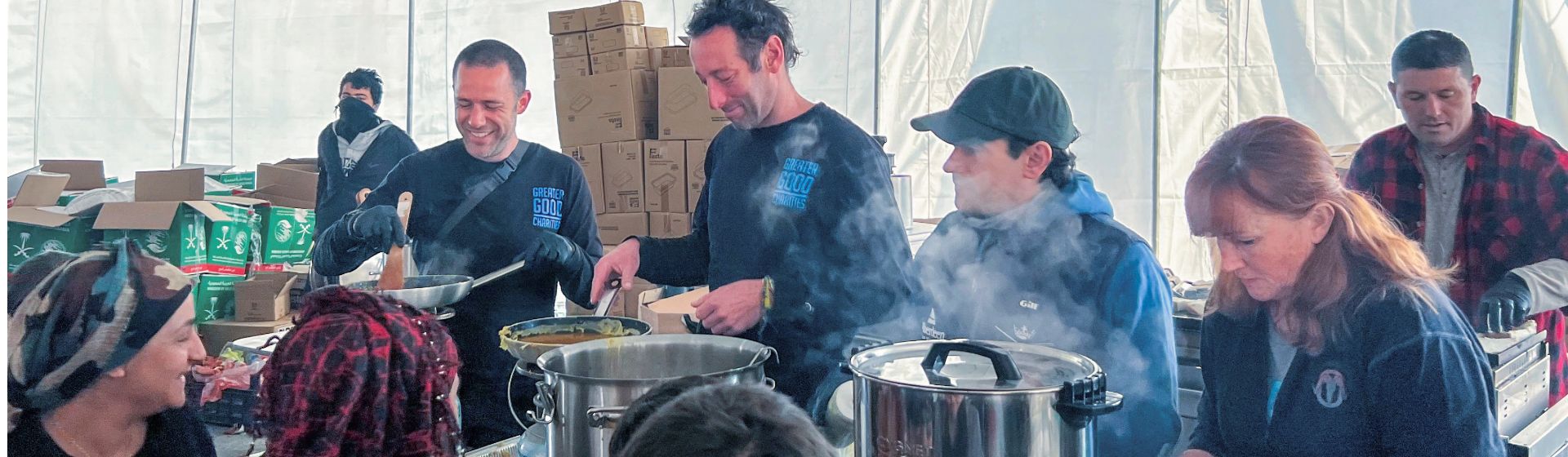 group of volunteers and Greater Good Charities serving community members meals after the Turkey Earthquake
